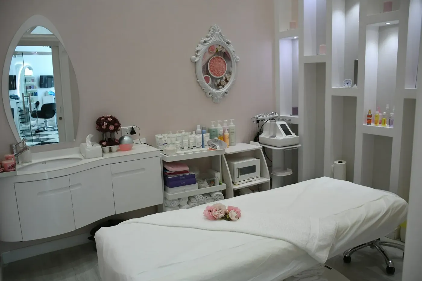 A furnished treatment room with a treatment bed